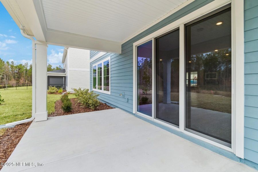 Exterior details and patio area of a home in Tributary 70', Yulee (Image 3).
