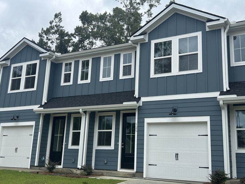Front exterior of a new home in , Summerville, SC, highlighting curb appeal (Image 19).