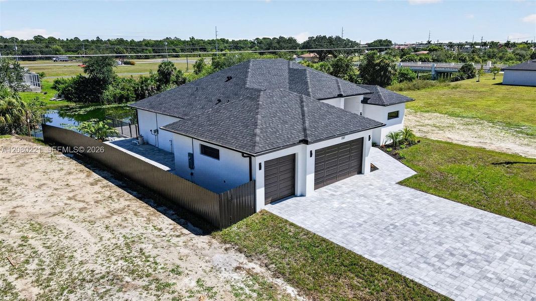 Front exterior of a new home in , Cape Coral, FL, highlighting curb appeal (Image 30).