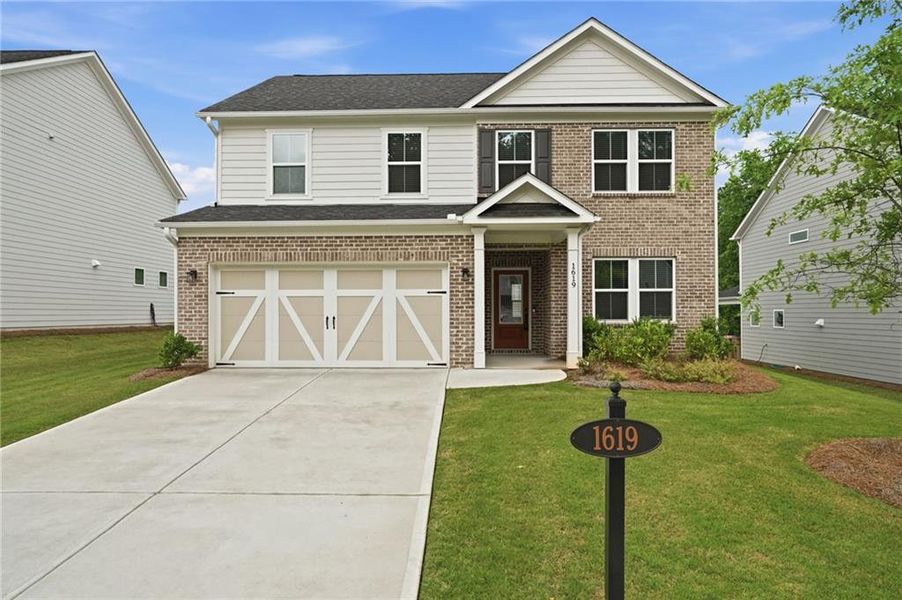 Front exterior of a new home in Berkeley Mill, Cumming, GA, highlighting curb appeal (Image 19).