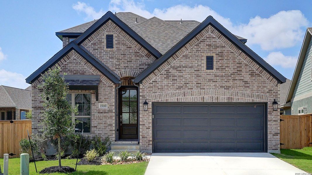 Front exterior of a new home in Ladera, San Antonio, TX, highlighting curb appeal (Image 2).