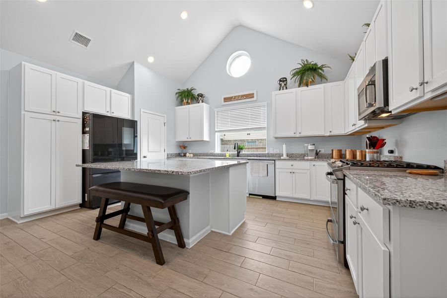 Open kitchen layout with generous counter space and ample storage