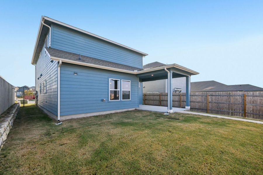 Exterior details and patio area of a home in Whisper Valley, Manor (Image 19).