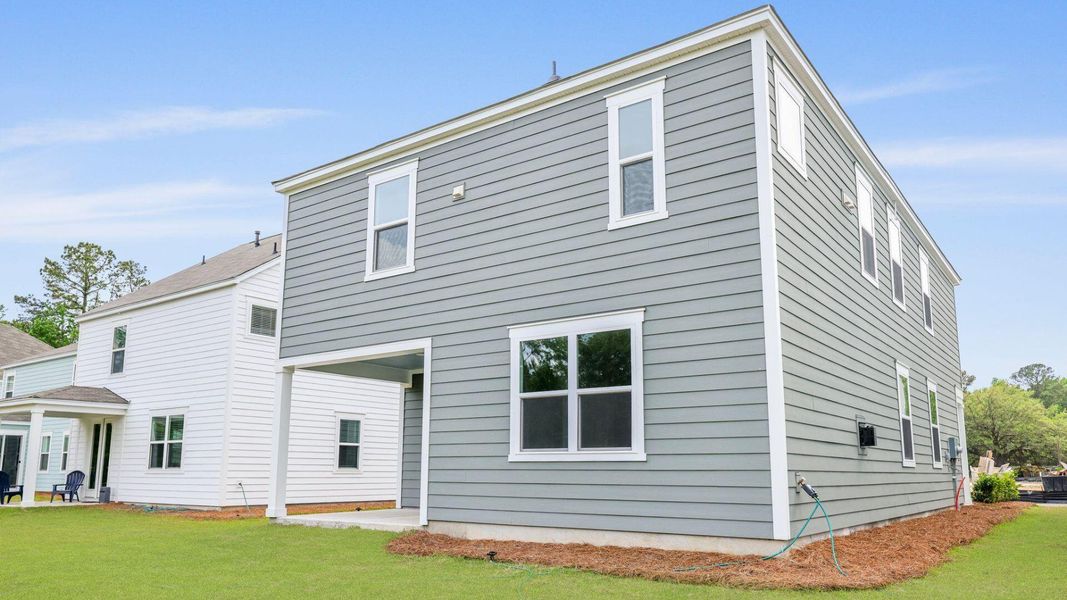 Front exterior of a new home in Founders Corner, Lincolnville, SC, highlighting curb appeal (Image 22).