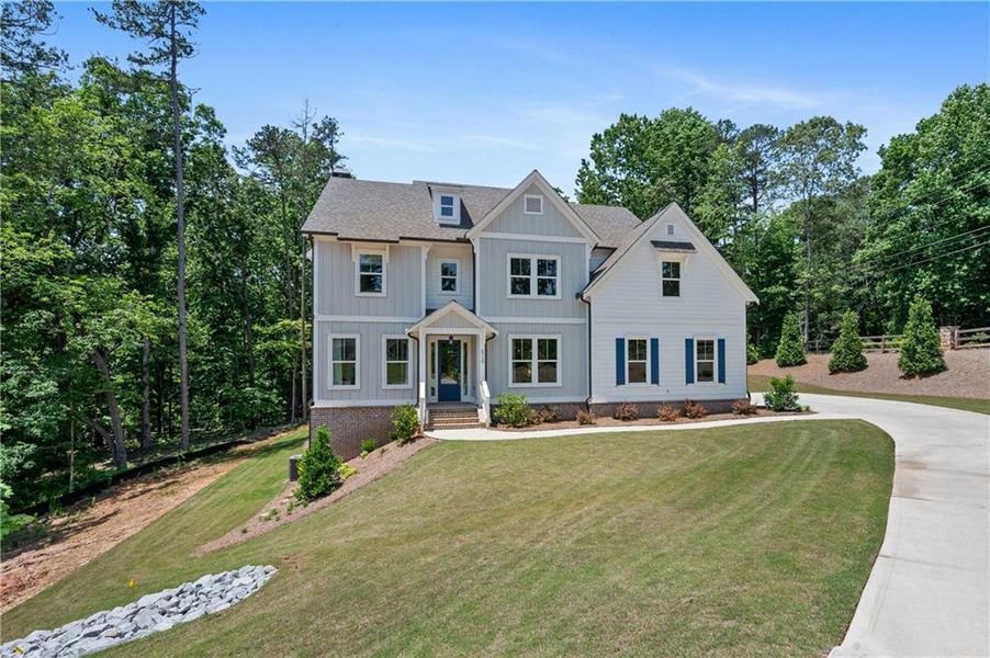 Front exterior of a new home in , Cumming, GA, highlighting curb appeal (Image 2).