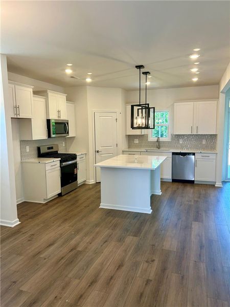 This spacious kitchen offers a central island and