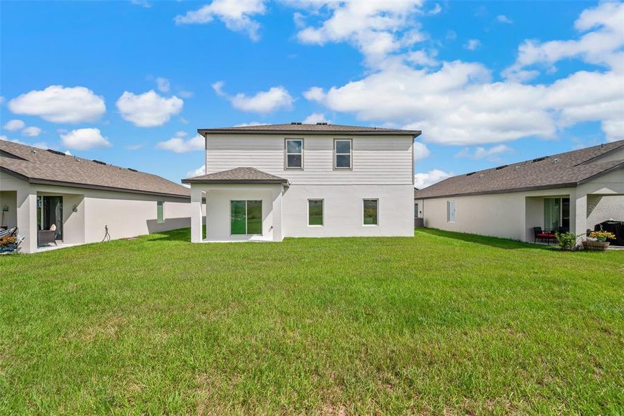 Exterior details and patio area of a home in Peach Crossings, Winter Haven (Image 3).