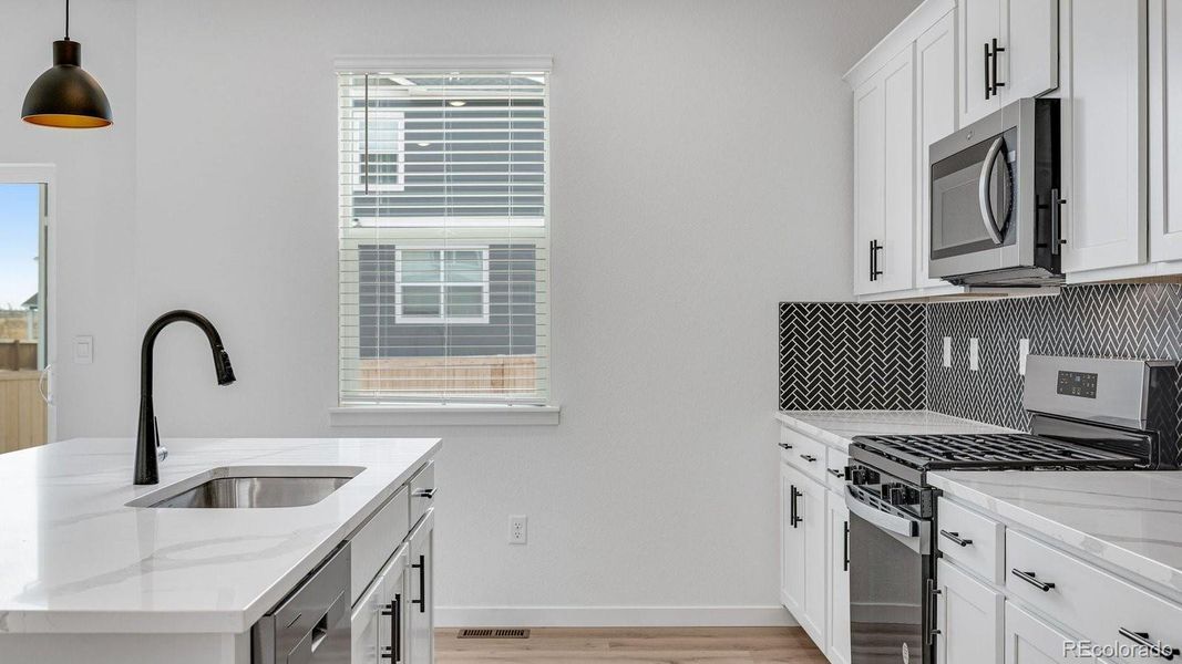 Furnished interior view inside a new home in Trails at Crowfoot, Parker (Image 8).