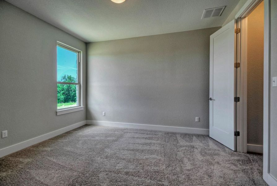 Representative unfurnished interior of a home built from the Madera II by Giddens Homes in Scofield Farms Estates, Georgetown (Image 24).