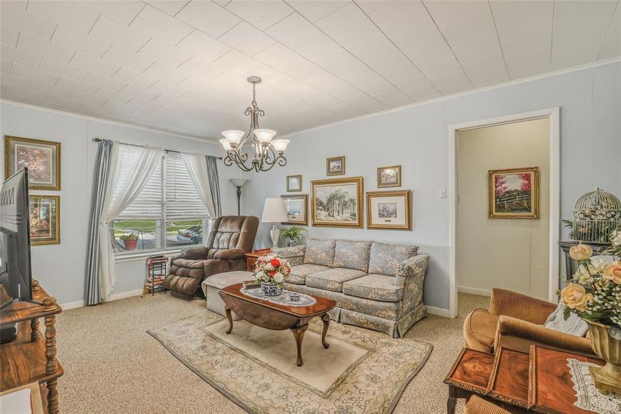 Inviting living area featuring light blue walls and textured ceiling Inviting living area featuring light blue walls and textured ceiling