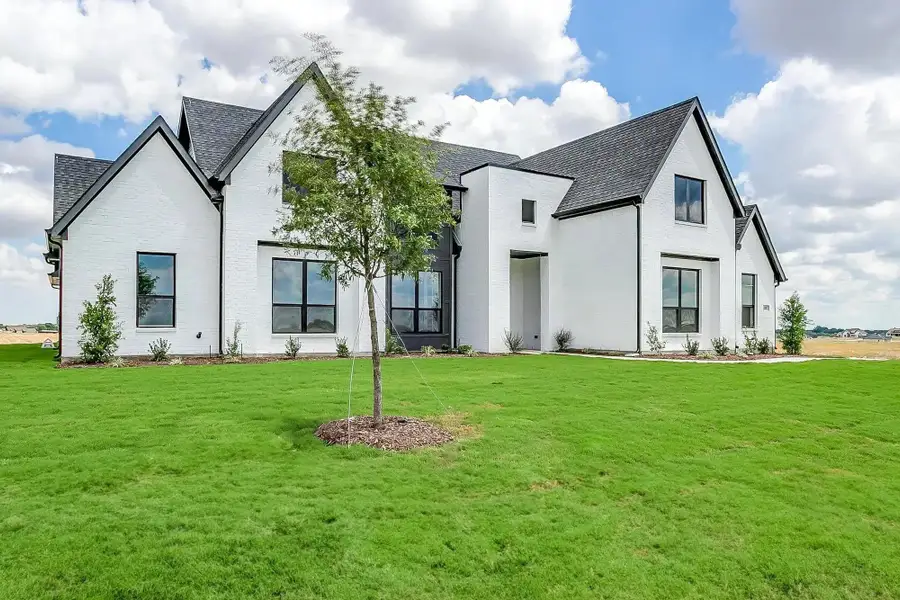 Representative exterior photo of a completed home built from the The Blaire by Elmwood Custom Homes in Hidden Lakes on Mockingbird, Midlothian, TX (Image 3). Representative exterior photo of a completed home built from the The Blaire by Elmwood Custom Homes in Hidden Lakes on Mockingbird, Midlothian, TX (Image 3).