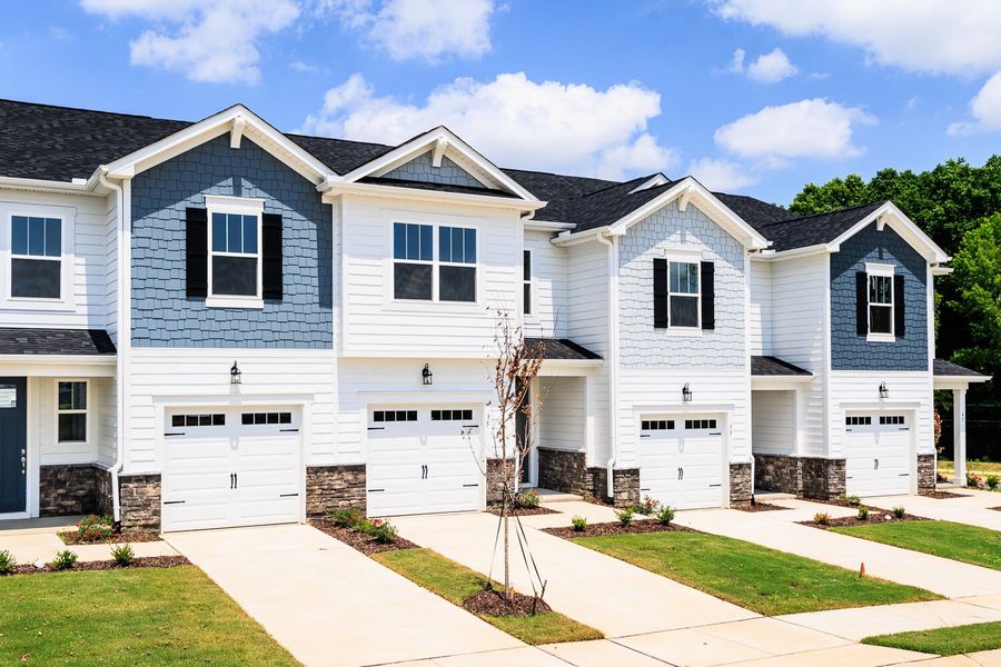Front exterior of a new home in Vaughan Farms, Angier, NC, highlighting curb appeal (Image 2). Front exterior of a new home in Vaughan Farms, Angier, NC, highlighting curb appeal (Image 2).