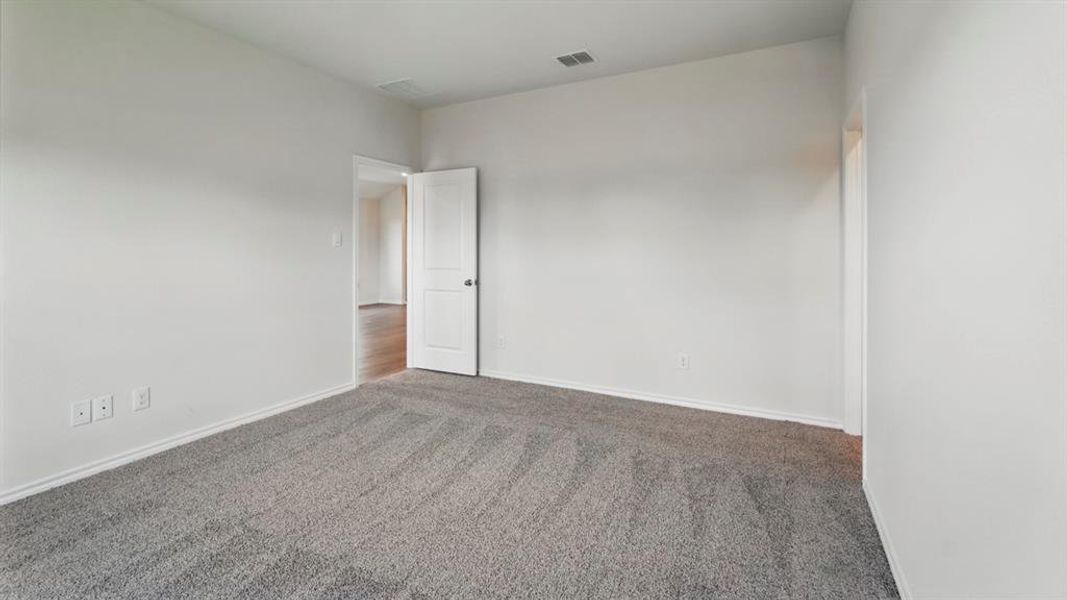 Unfurnished room featuring carpet flooring and baseboards