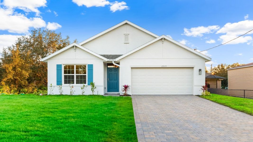 Front exterior of a new home in Lehigh Acres Spot Lots, Lehigh Acres, FL, highlighting curb appeal (Image 1). Front exterior of a new home in Lehigh Acres Spot Lots, Lehigh Acres, FL, highlighting curb appeal (Image 1).