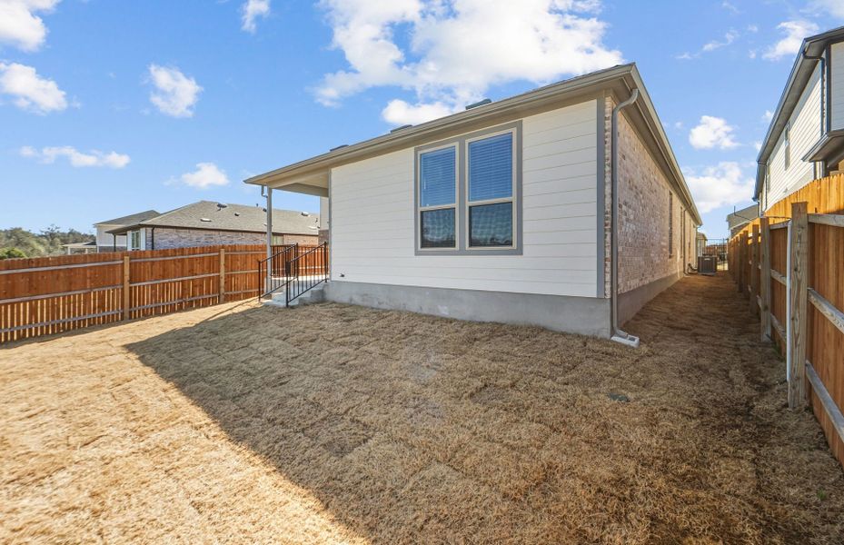Exterior details and patio area of a home in Saddleback at Santa Rita Ranch, Liberty Hill (Image 23).