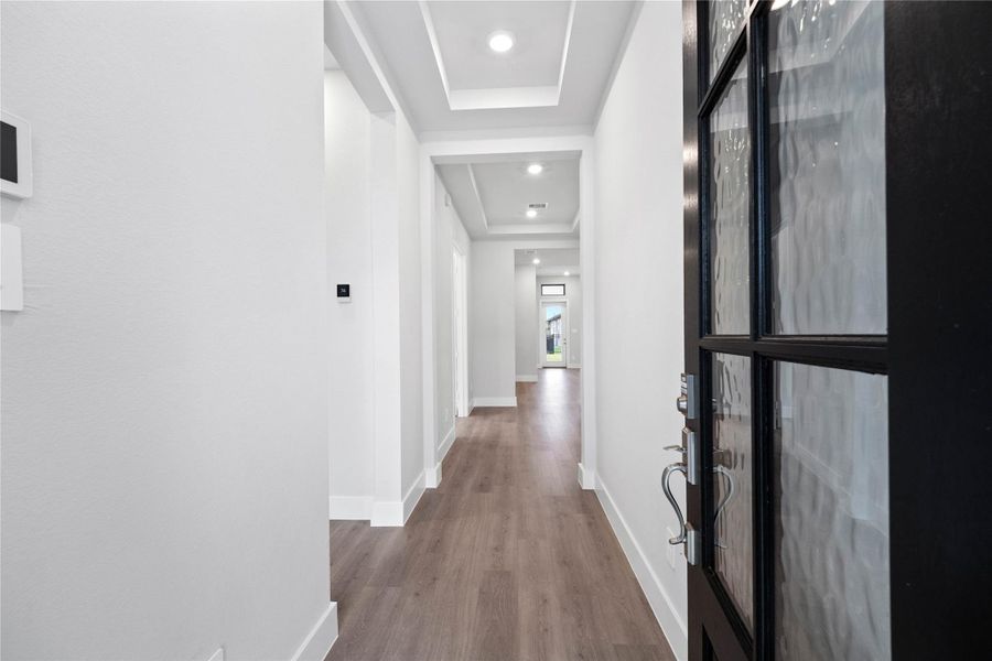 The entryway area is bright and modern, offering a welcoming first impression with clean lines and stylish finishes.