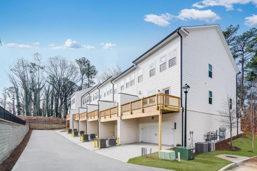 Exterior details and patio area of a home in Towns at Creekside, Doraville (Image 3).