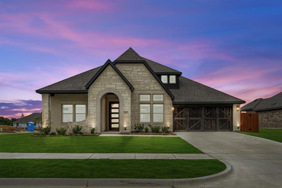 Front exterior of a new home in The Retreat at North Grove 60, Waxahachie, TX, highlighting curb appeal (Image 24). Front exterior of a new home in The Retreat at North Grove 60, Waxahachie, TX, highlighting curb appeal (Image 24).