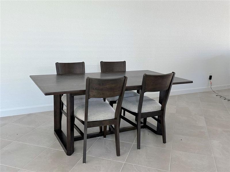 Furnished interior view inside a new home in Palm Lake at Coco Bay, Englewood (Image 9).