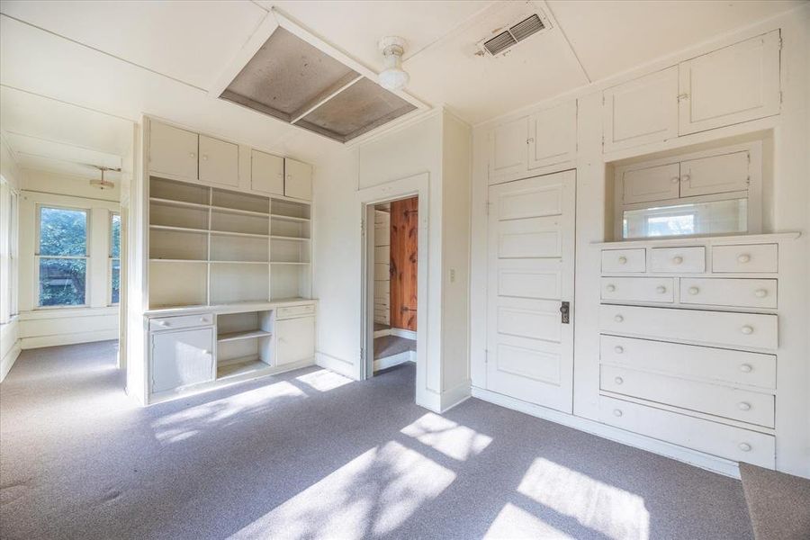 Unfurnished bedroom featuring carpet and a closet