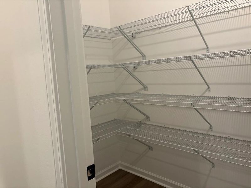 Pantry featuring the AW Collection® Foundry - High contrast and hidden function.