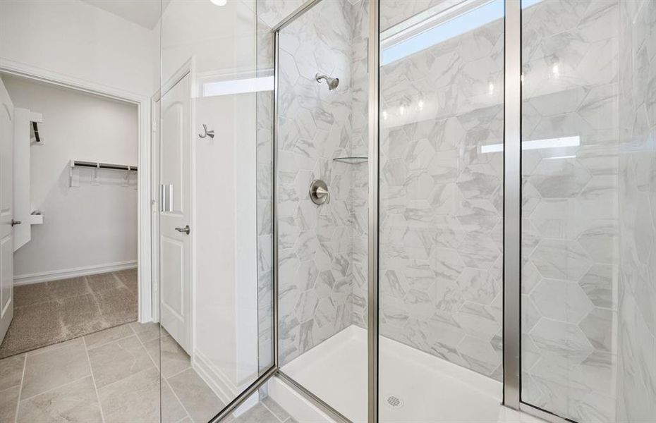 Owner's bath with large shower.