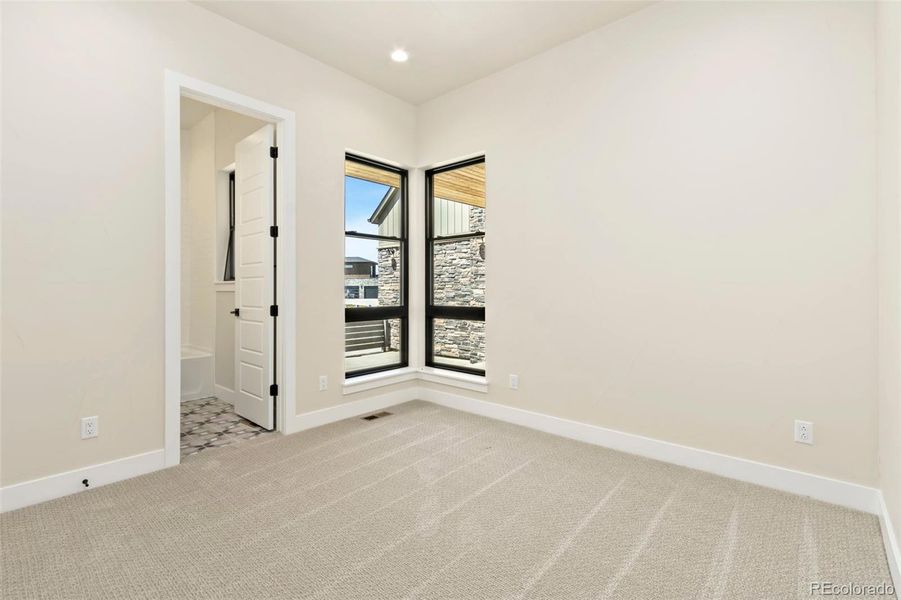 Spacious, unfurnished interior of a new home in Acadia at RainDance, Windsor (Image 20).