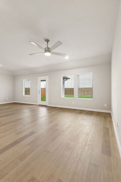 Living Room in the Emmy II home plan by Trophy Signature Homes - REPRESENTATIVE PHOTO
