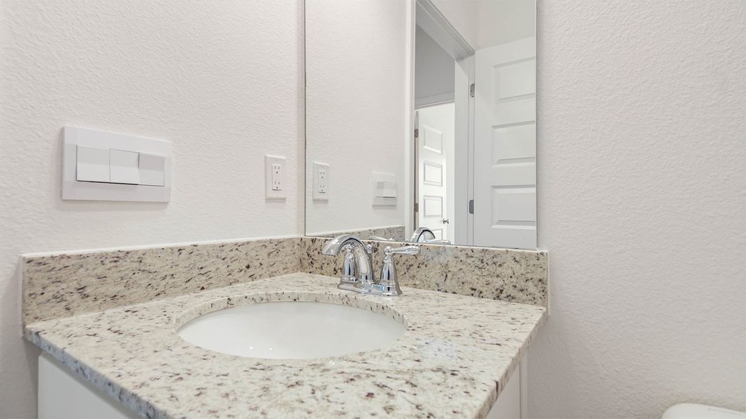 Representative furnished interior of a home built from the Aspen by D.R. Horton in Owl's Head East, Freeport (Image 17).