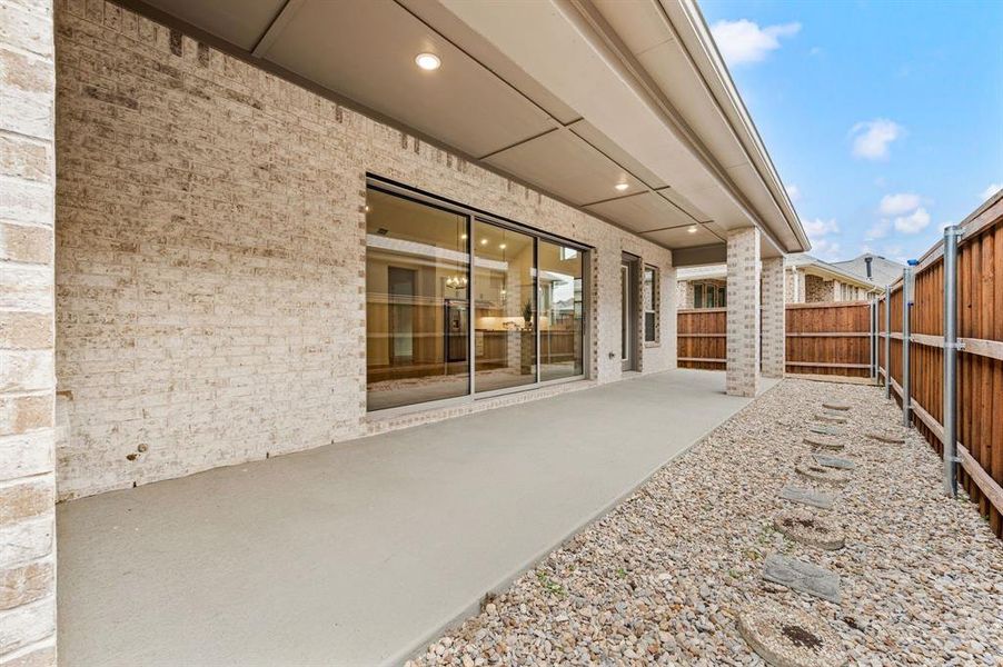 Exterior details and patio area of a home in Elements at Viridian - Garden Series, Arlington (Image 24).