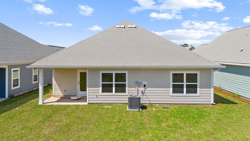 Exterior details and patio area of a home in Caballeros Estates At Hombre, Panama City Beach (Image 3).