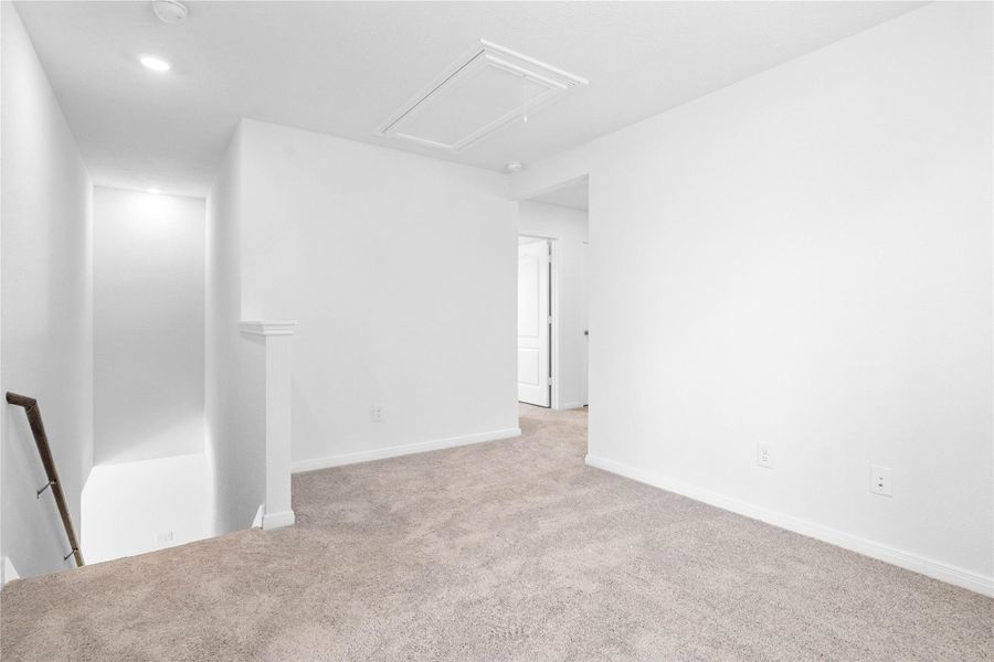 Another perspective from the Loft, showcasing the staircase and hallway leading to the secondary bedrooms. Another perspective from the Loft, showcasing the staircase and hallway leading to the secondary bedrooms.