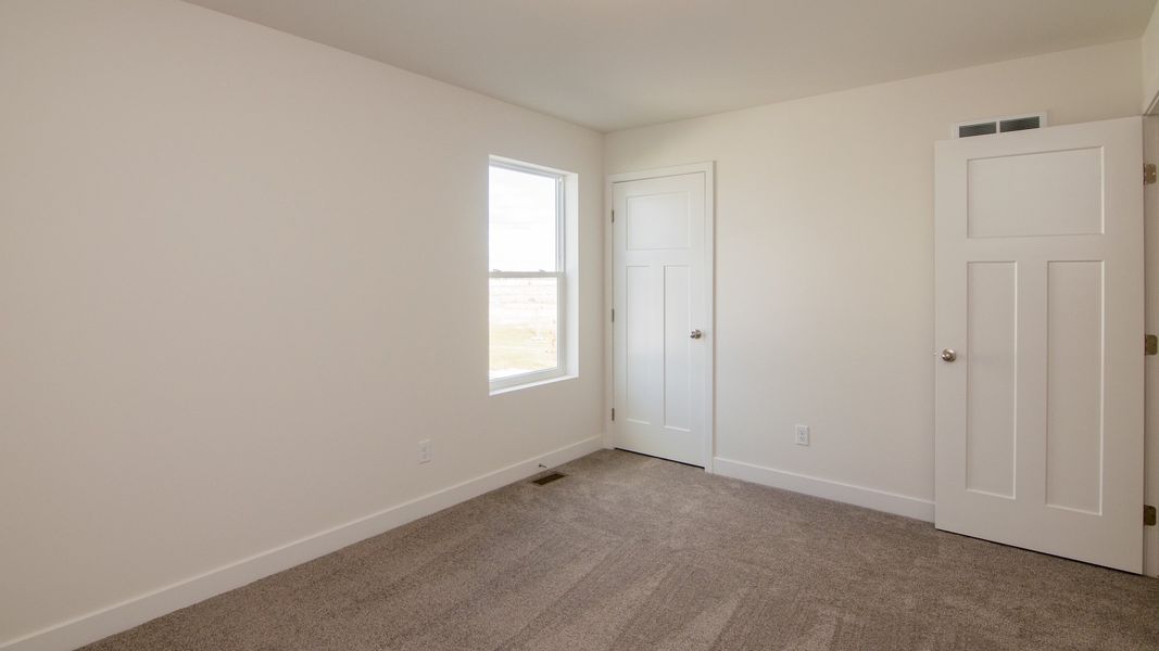Representative unfurnished interior of a home built from the The Hartland by Norfolk Homes in Coronado Estates, Jackson (Image 73).