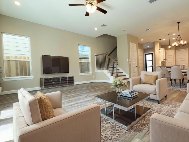 The ROCburne’s living room is designed for both comfort and style, featuring soaring ceilings, abundant natural light, and an open flow that seamlessly connects to the kitchen and dining areas—perfect for both everyday living and entertaining. Image depicts home as-is. The ROCburne’s living room is designed for both comfort and style, featuring soaring ceilings, abundant natural light, and an open flow that seamlessly connects to the kitchen and dining areas—perfect for both everyday living and entertaining. Image depicts home as-is.