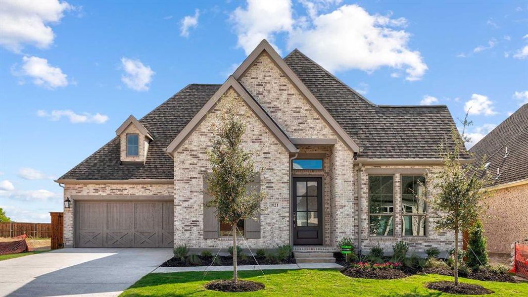 Front exterior of a new home in Terraces 62', Rockwall, TX, highlighting curb appeal (Image 19). Front exterior of a new home in Terraces 62', Rockwall, TX, highlighting curb appeal (Image 19).