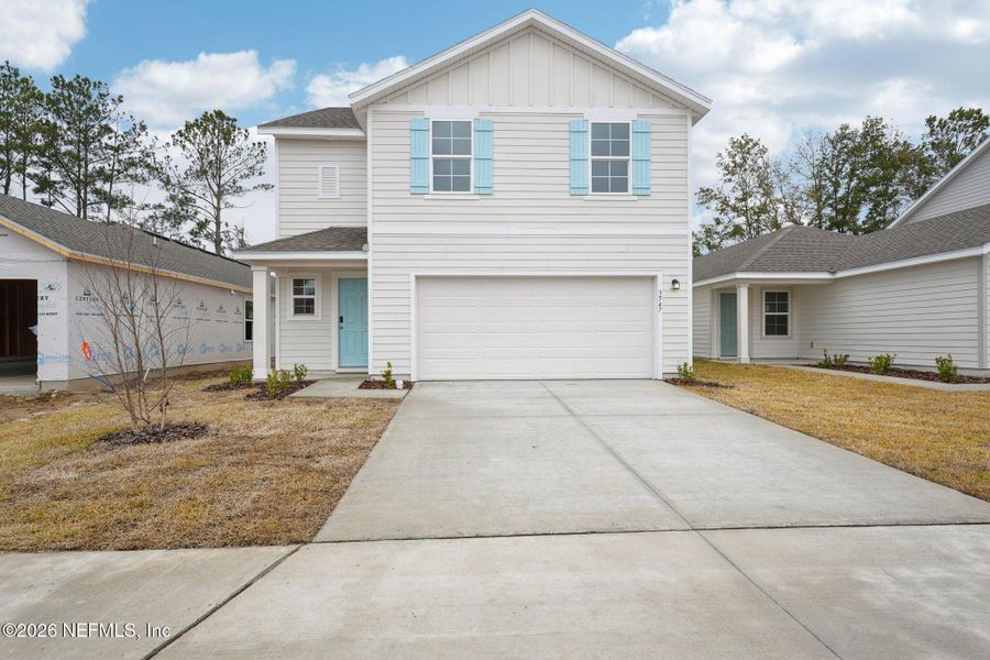 Front exterior of a new home in Kings Landing, Jacksonville, FL, highlighting curb appeal (Image 7). Front exterior of a new home in Kings Landing, Jacksonville, FL, highlighting curb appeal (Image 7).
