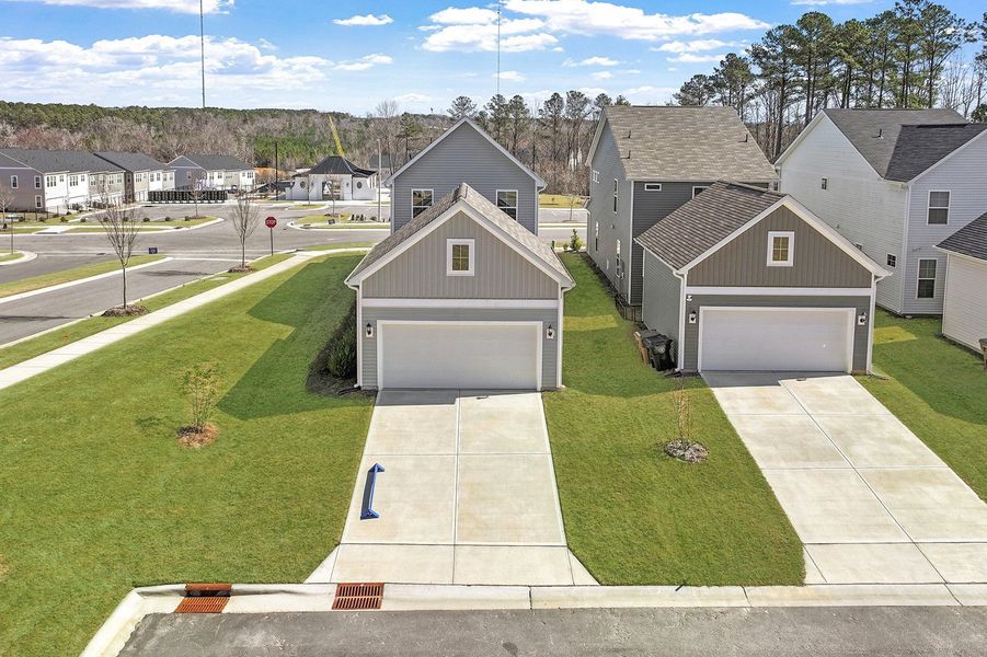 Front exterior of a new home in Renaissance at White Oak, Garner, NC, highlighting curb appeal (Image 22).