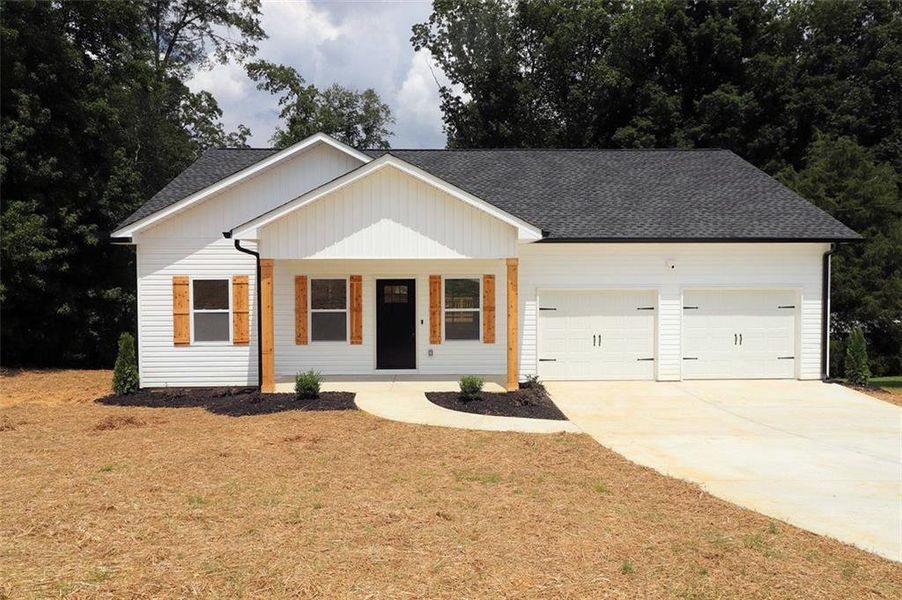 Front exterior of a new home in , Carrollton, GA, highlighting curb appeal (Image 15).