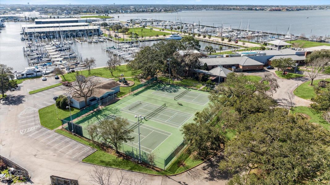 LYC tennis/pickleball court, the clubhouse and marina.   Associate Level  Membership Initiation Fee included in purchase.   Application process still required by/per LYC and regular membership fees not included.  Townhome is within steps of all the amenities.