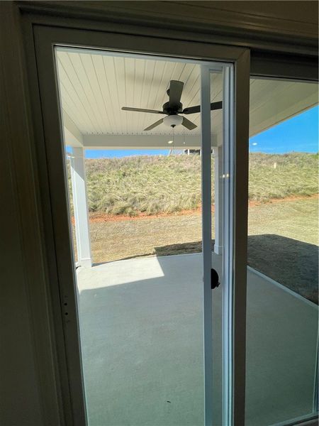 An inviting covered patio offers a refreshing outd