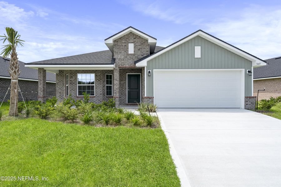 Front exterior of a new home in Shadow Crest at Rolling Hills, Green Cove Springs, FL, highlighting curb appeal (Image 2). Front exterior of a new home in Shadow Crest at Rolling Hills, Green Cove Springs, FL, highlighting curb appeal (Image 2).