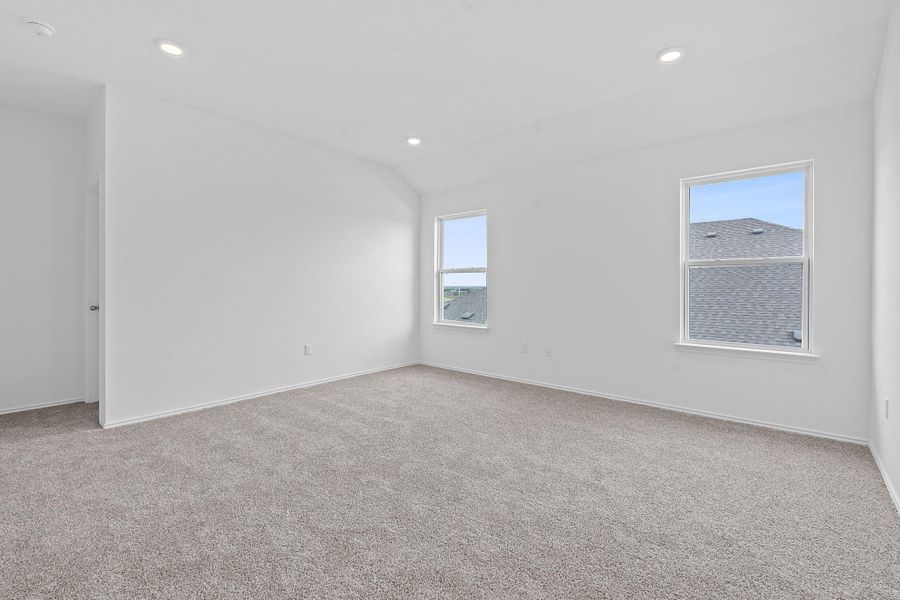 Unfurnished room with light carpet, recessed lighting, and lofted ceiling Unfurnished room with light carpet, recessed lighting, and lofted ceiling