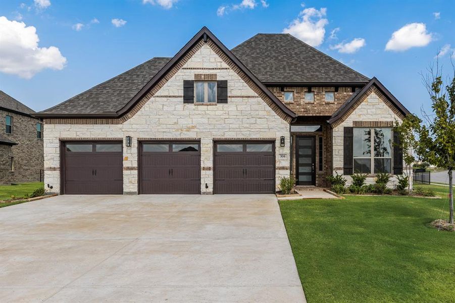 Front exterior of a new home in Heath Golf and Yacht, Heath, TX, highlighting curb appeal (Image 17).