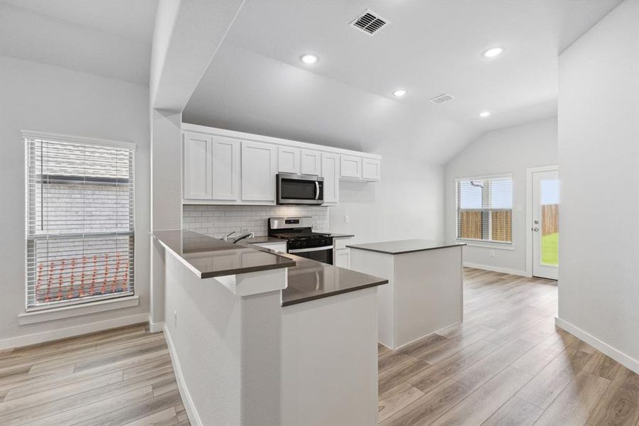 Kitchen in the Amber home plan by Trophy Signature Homes – REPRESENTATIVE PHOTO