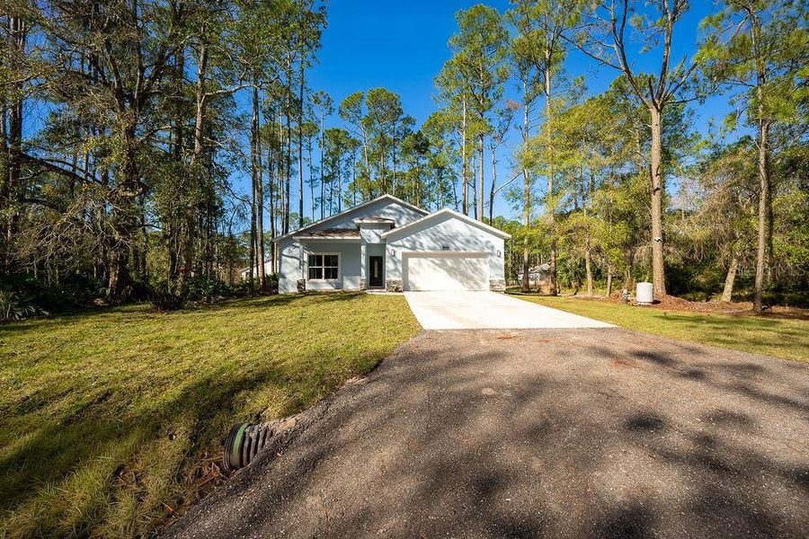 Front exterior of a new home in , Deland, FL, highlighting curb appeal (Image 23).