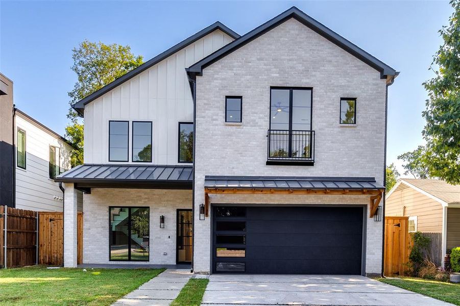 Modern inspired farmhouse with a garage