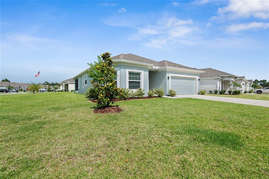 Front exterior of a new home in Sawmill Creek at Palm Coast Park, Palm Coast, FL, highlighting curb appeal (Image 30). Front exterior of a new home in Sawmill Creek at Palm Coast Park, Palm Coast, FL, highlighting curb appeal (Image 30).