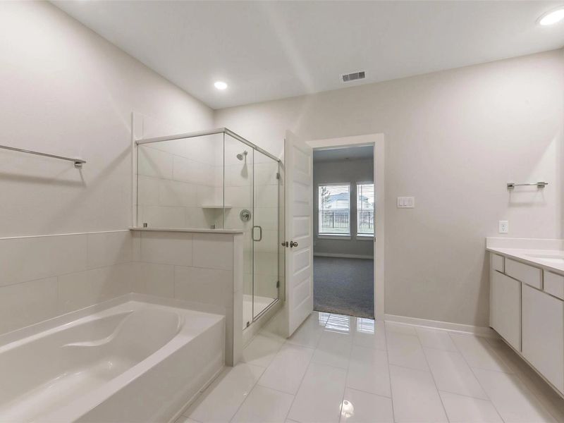 Furnished interior view inside a new home in Sunterra, Katy (Image 8).