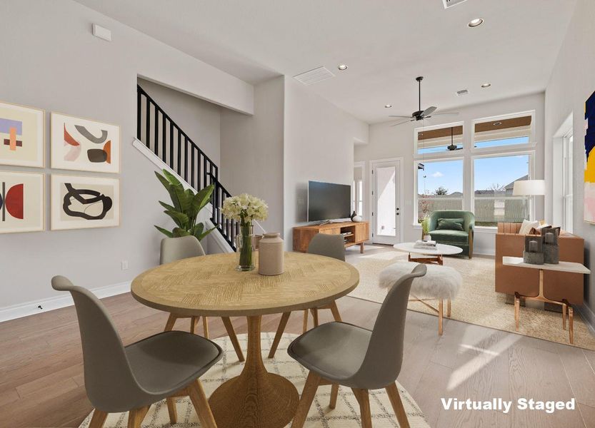 Dining room featuring stairway, visible vents, recessed lighting, wood finished floors, and a ceiling fan Dining room featuring stairway, visible vents, recessed lighting, wood finished floors, and a ceiling fan