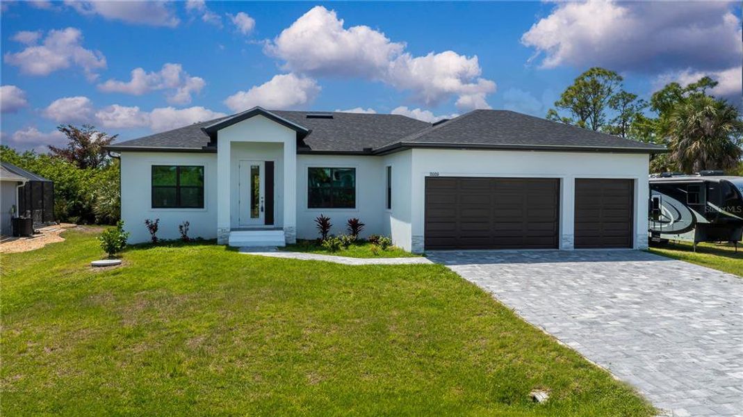 Front exterior of a new home in , Port Charlotte, FL, highlighting curb appeal (Image 27).
